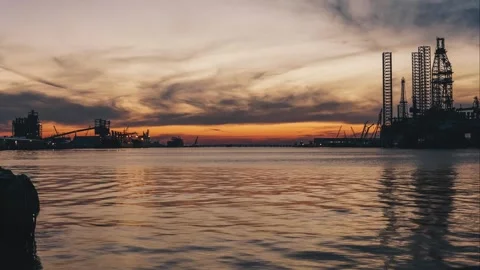 Freight ship loading port sunset timelaps Stock Footage 248260438