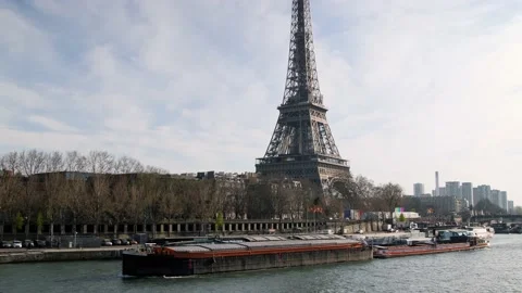Freight ship passing by Eiffel tower in Paris Stock Footage 182890067