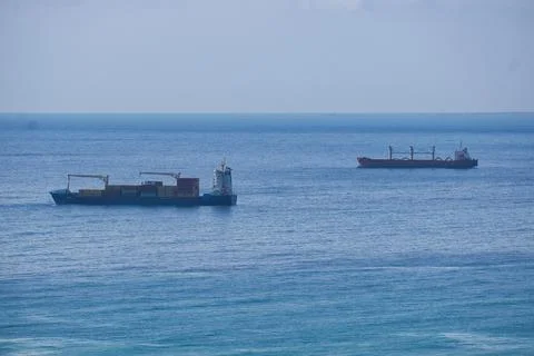 Freight ship setting sail from the port Foto stock