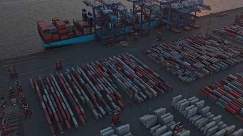 Freight shipping terminal with stacked cargo containers Stock Footage 318620135