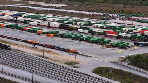 Freight Trailers Beside Railway Tracks at Intermodal Transfer Hub Stock Footage 337715482