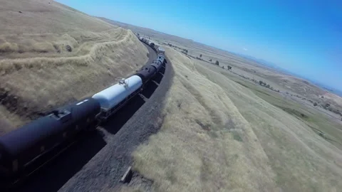Freight train aerial flying over railroad tracks Stock Footage 240119676