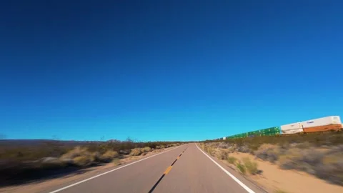 Freight Train Along Mojave Desert Highway POV Drive in California Vídeos de archivo 344620714
