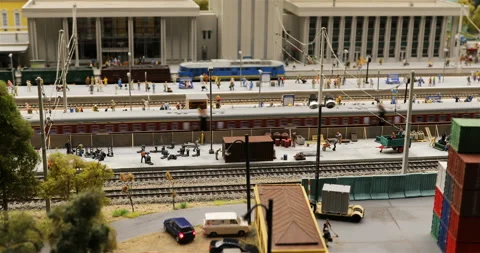 Freight train and high-speed train passing railway station 動画素材 102482292