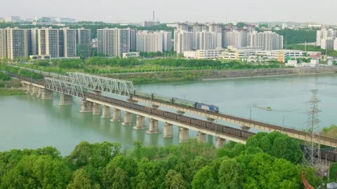 Freight train and passenger train pass in opposite directions Stock Footage 334159798