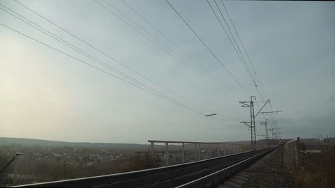 Freight train approaches and drives near the camera on the railway bridge Stock Footage 123410943