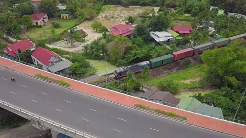 A freight train approaches a large city, shooting from a flying camera Video stock 236086954