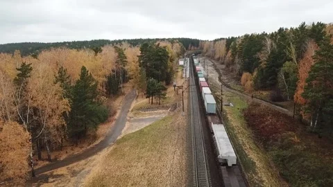 Freight train in the autumn forest, top view Stock Footage 141705393