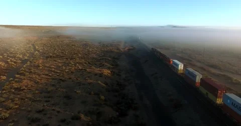 Freight train breaking through fog Stock Footage 62180970