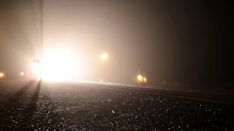 Freight train bright lights through night fog Voorheesville New York USA  Stock Footage