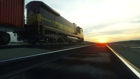 Freight train with cargo containers. Against Sunrise. logistic concept. Stock Footage
