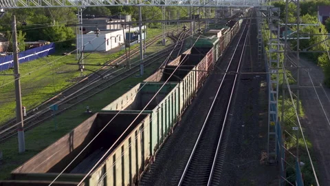 Freight train carries cargo. View of the train from above. Rail transport for Stock Footage 132222984