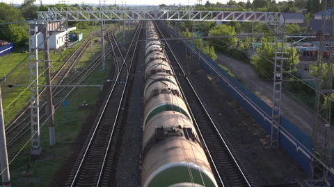 Freight train carries cargo. View of the train from above. Rail transport for Stock Footage 132223223