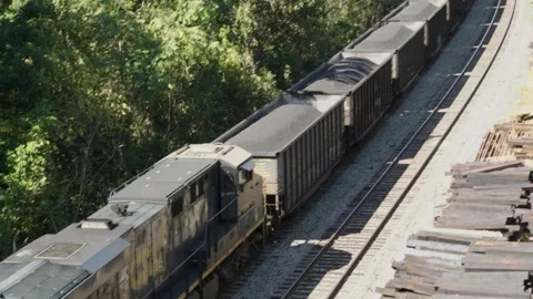 A freight train carrying coal parked in a rail yard. Stock Footage 250484314