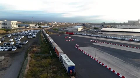Freight Train Carrying Containers Passing Through Industrial Port Zone in Le Stock Footage 337976160