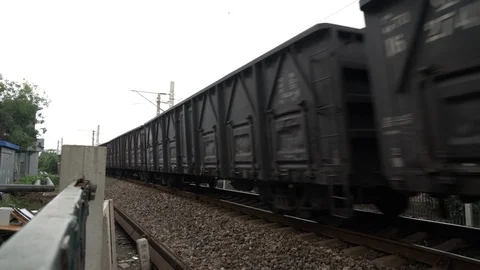 A freight train carrying containers running on the rail in Beijing Stock Footage 93891564