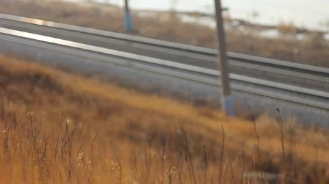 Freight train carrying  containers through scenic landscape. Close-up Video stock 64636142