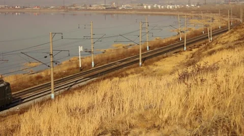 Freight train carrying  containers through scenic landscape. Stock Footage 64636207