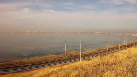 Freight train carrying  containers through scenic landscape. Close-up Stock Footage 64636280