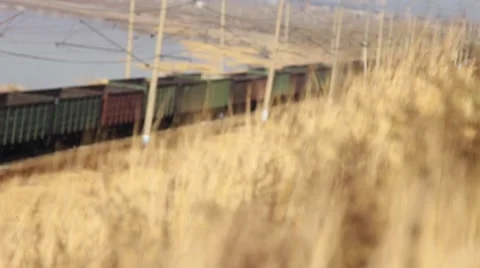 Freight train carrying  containers through scenic landscape. Stock Footage 64636286