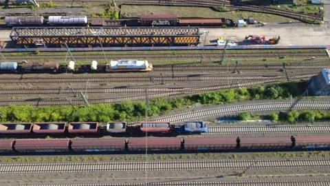 Freight Train Carrying Crushed Stone in Frankfurt – Aerial Tracking Shot Video stock 346767646
