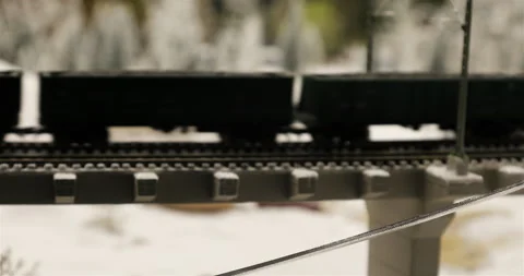 Freight train cars passing through the overpass structures of the overpass Stock Footage 102479697