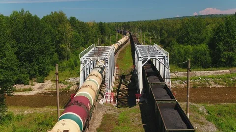 Freight train with cisterns and containers on the railway. Aerial view Container Stock Footage 90066971