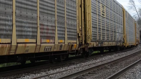 Freight Train  close up of train cars then disappearing down the track Stock Footage