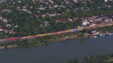 Freight train, colored containers, railway by the river, aerial view Stock Footage 123661726