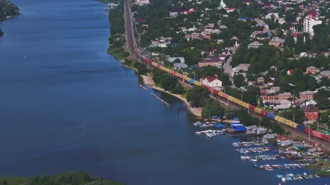 Freight train, colored containers, railway by the river, aerial view Stock Footage 123662126