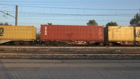 Freight Train With Colorful Containers Passing By On Railway - C0001 Stock Footage 292640736