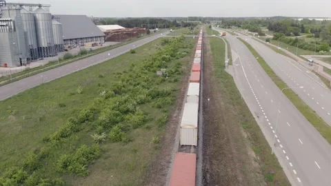 Freight train with containers leaving seaport trade concept 動画素材 209615957