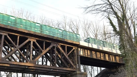 Freight train crossing bridge overhead Video stock 127188181
