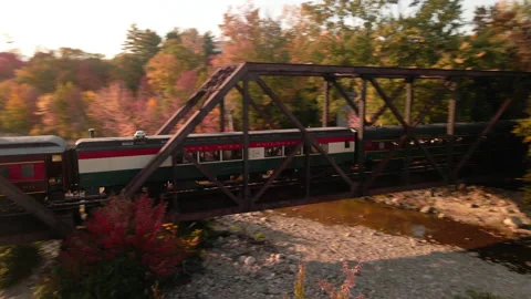 Freight Train Crossing Bridge at Sunset Stock Footage 141291934