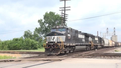 Freight train crossing double diamond intersection Stock Footage 99018342