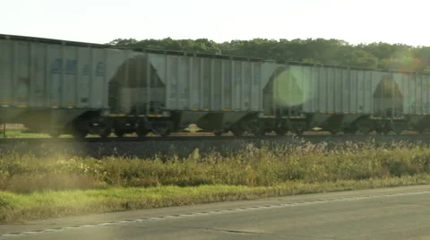 Freight Train crossing at Magic Hour Stock Footage 50085802
