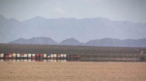 Freight train crossing Mohave Desert, California Stock Footage 8762465
