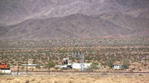 Freight train crossing the Mojave Desert Stock Footage 20501915