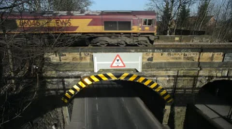 Freight train crossing rail bridge over road at Woodlesford leeds united kingdom Stock Footage 21843013