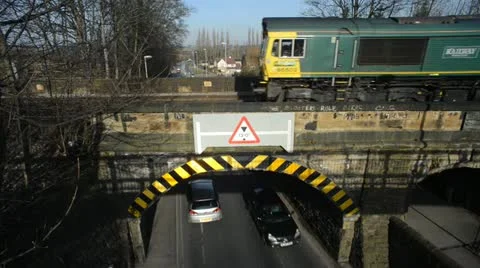 Freight train crossing rail bridge over road at Woodlesford leeds united kingdom Stock Footage 21843131