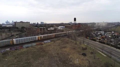 Freight Train In Detroit Passes A Junk Yard Stock Footage 106452405