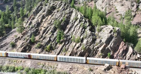 Freight Train Disapears into a Mountain Tunnel Aerial View Paradise Montana 스톡 동영상 335706382