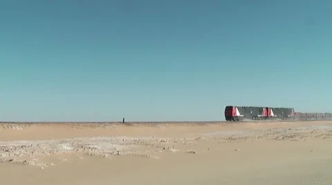 Freight train driving through desert Video stock 7734486
