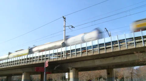 Freight train on elevated railway passing through city Stock Footage 42159312