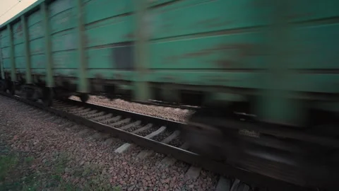 Freight Train End Cars Passing Low Wide Angle Shot | Cargo Railcars Moving Fast Stock Footage 341162265