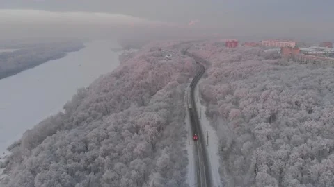Freight train goes through winter forest. Aerial fliyng backwards Video stock 146320499