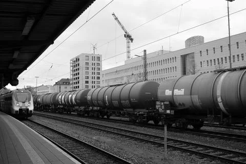 Freight Train Gradually Approaches Platform Sur.. Stock Photos