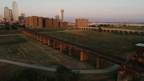 Freight Train Headed into Downtown Dallas Texas at Sunset Reunion Tower Stock Footage 113668290