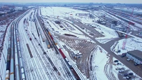 Freight train, laden with cargo along a railway in urban setting. Canadian .. Stock Footage 263685158