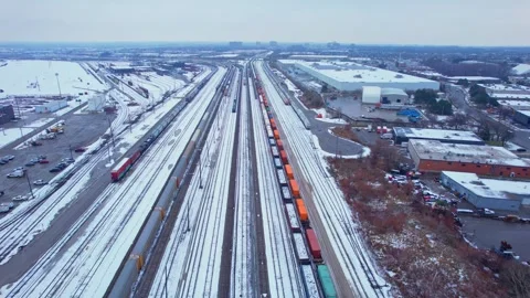 Freight train, laden with cargo along a railway in urban setting. Canadian .. Stock Footage 263685168